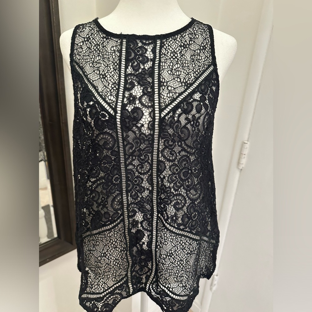 Express women’s top. Perfect addition. Never warm but washed ones. Size medium.